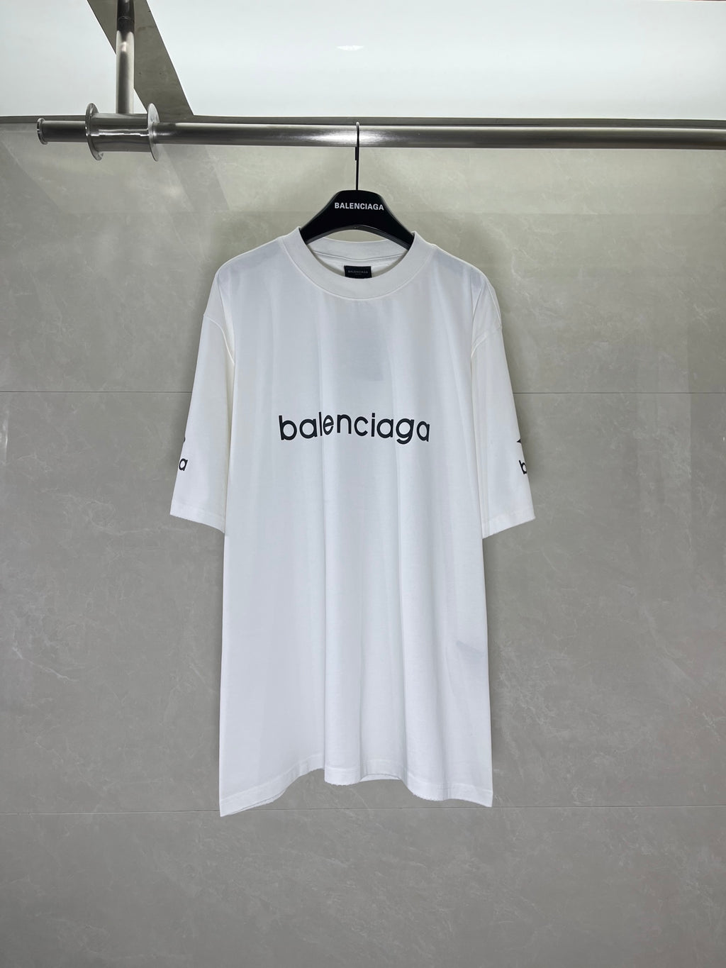 White crew-neck T-shirt with Balenciaga logo print at chest, short sleeves