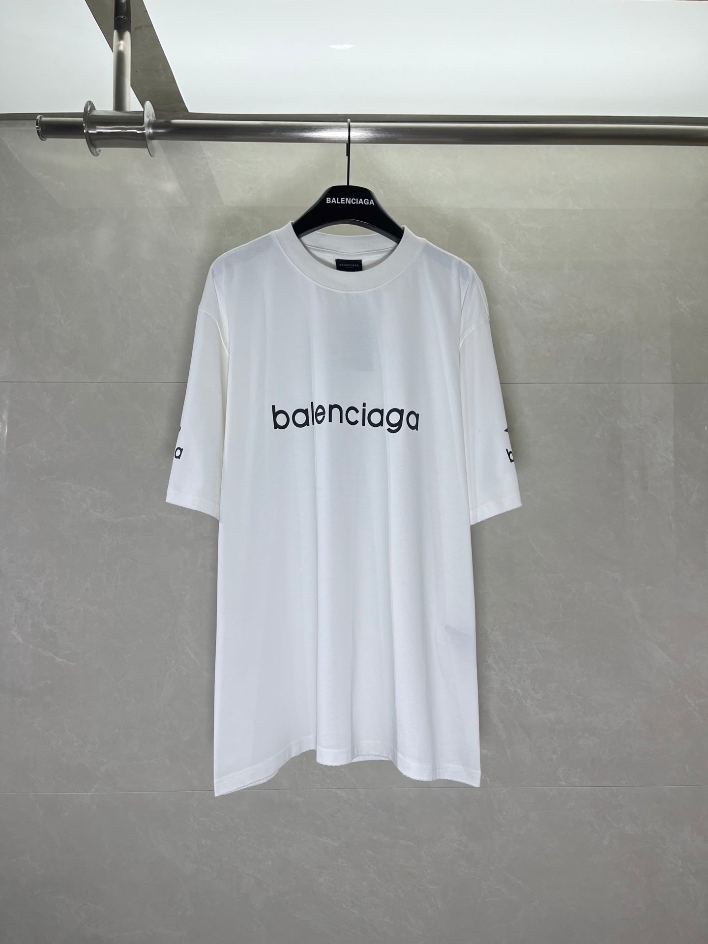 White crew-neck T-shirt with Balenciaga logo print at chest, short sleeves