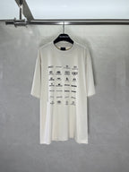 White short-sleeve T-shirt with all-over Balenciaga logo and icon print on front