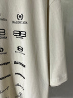 White T-shirt sleeve print with Balenciaga logos and small script details