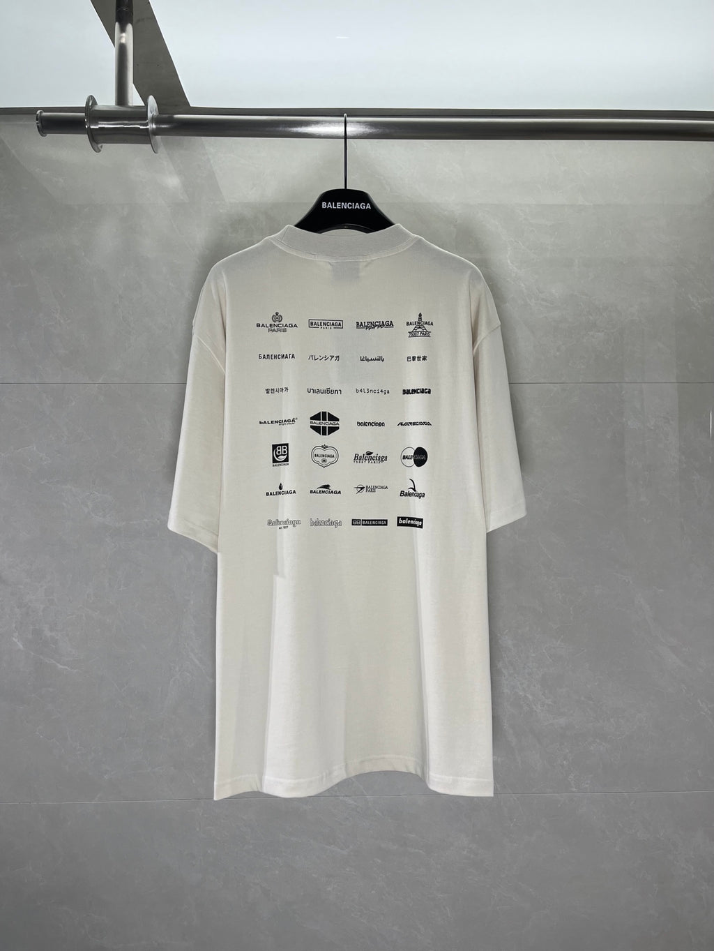 White short-sleeve T-shirt with Balenciaga logo and icon print on back