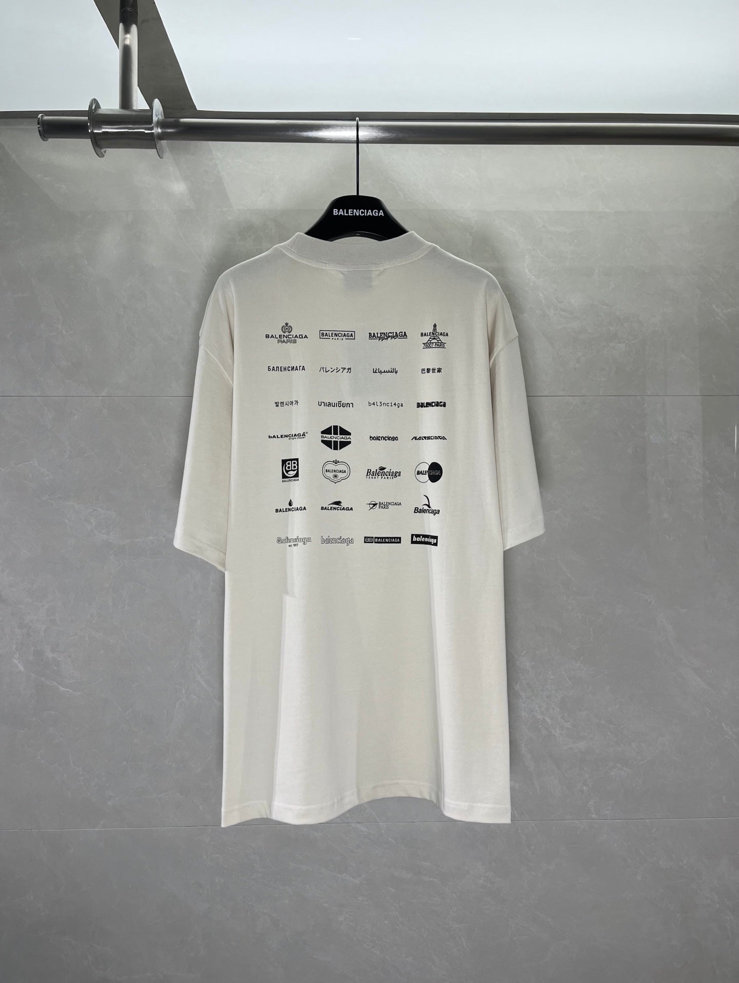White short-sleeve T-shirt with Balenciaga logo and icon print on back