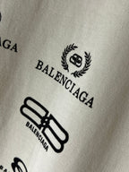 Close-up fabric with Balenciaga laurel crest logo and logo graphic