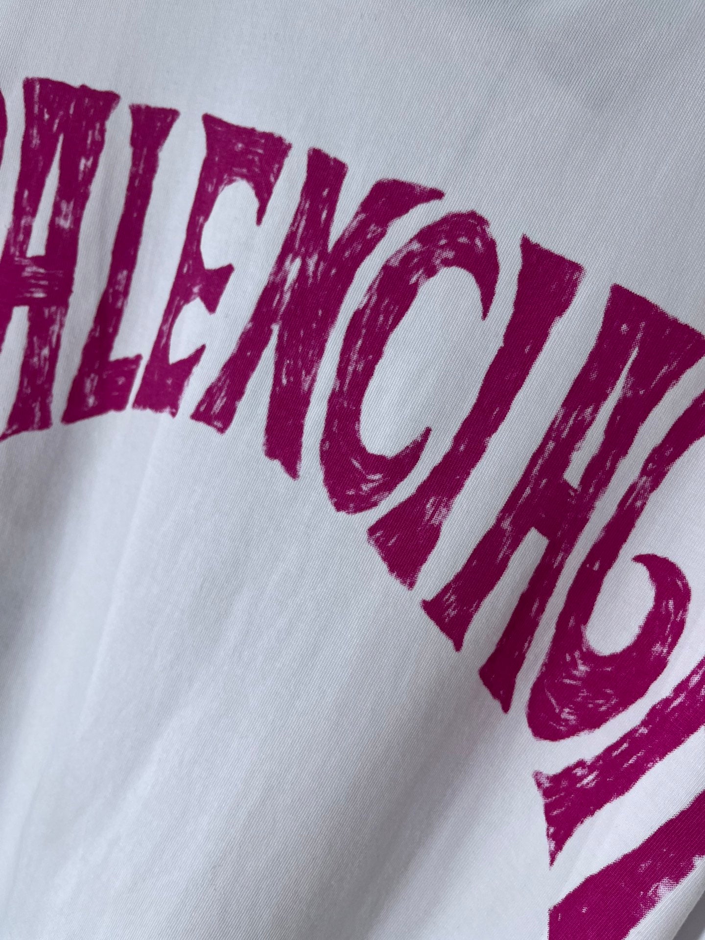 Balenciaga T-shirt close-up with magenta “BRAZIL” lettering