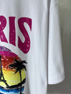 Balenciaga T-shirt close-up showing partial magenta “PARIS” lettering and palm