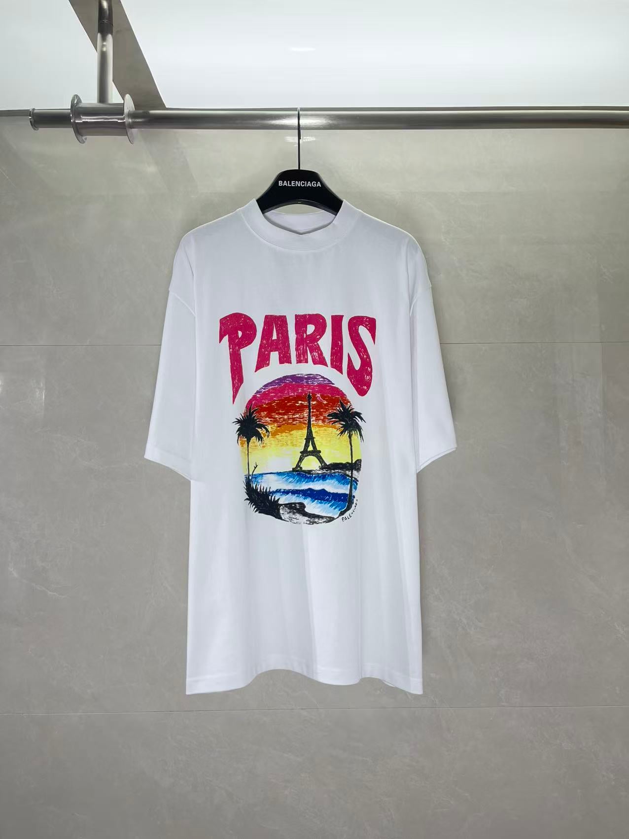 Balenciaga white T-shirt with multicolor “PARIS” graphic and palm tree print
