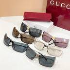 Gucci glasses set with multiple lens tints: blue, brown, and clear, black frames