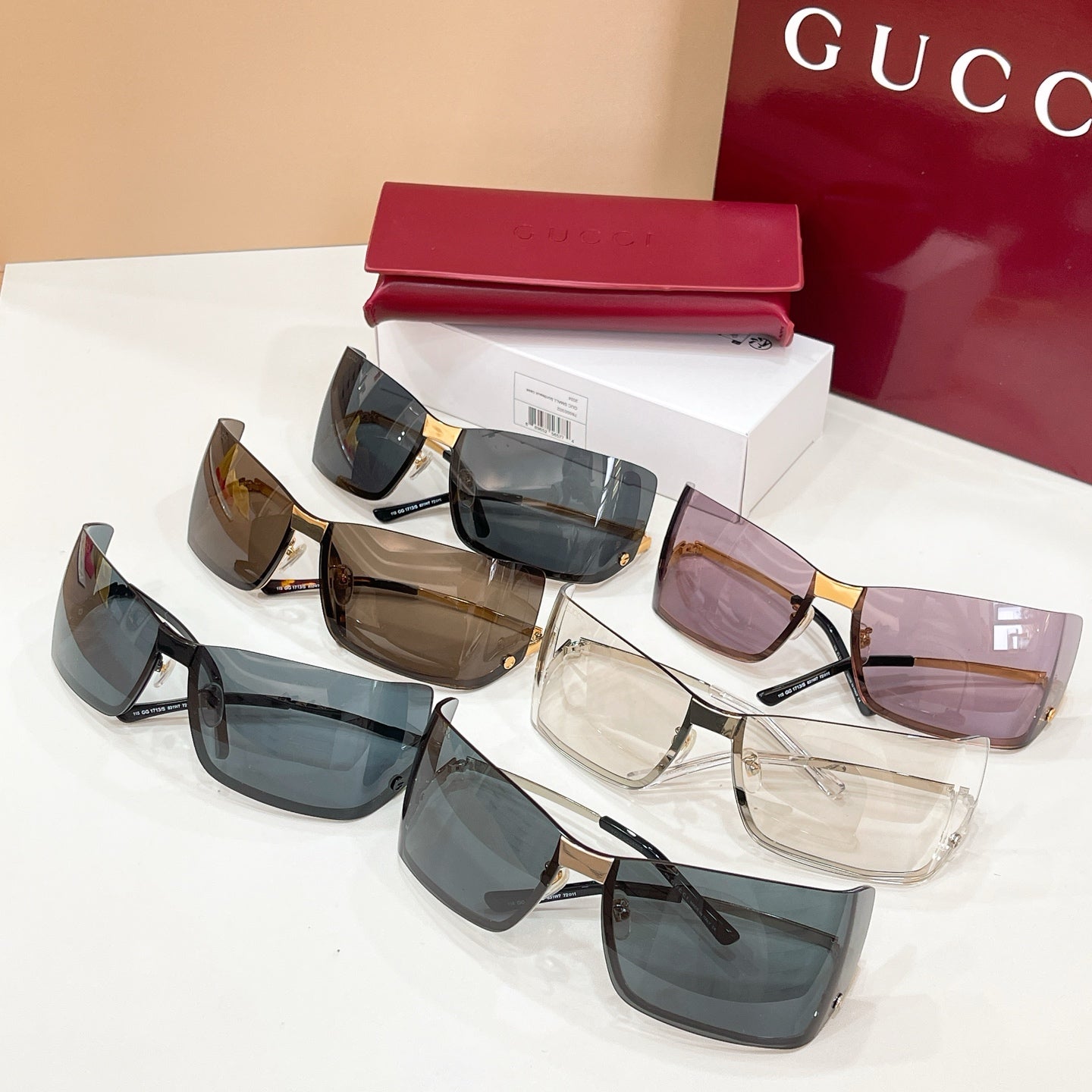 Gucci glasses set with multiple lens tints: blue, brown, and clear, black frames