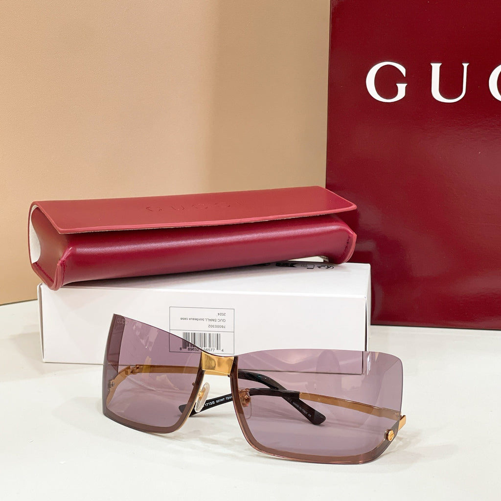 Gucci square sunglasses with gold frame, mauve tinted lenses, dark temples