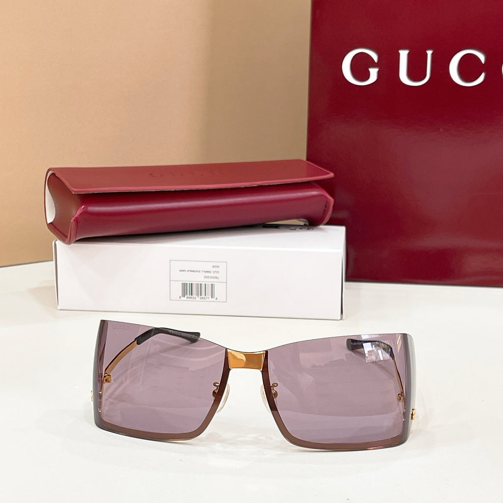 Gucci square sunglasses with gold frame, tinted mauve lenses, dark temples