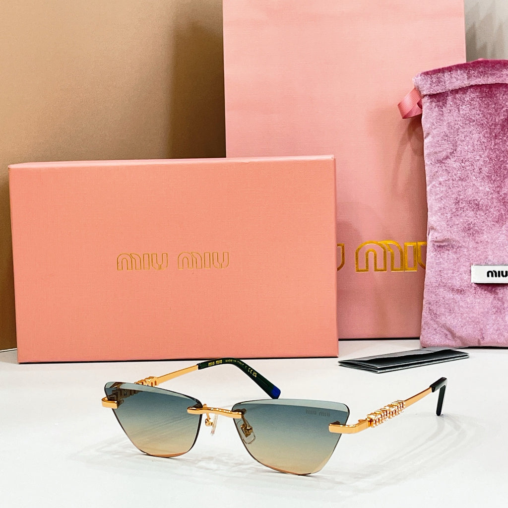 MiuMiu cat-eye sunglasses, gold frames, blue accents, light-brown tinted lenses