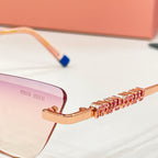 MiuMiu cat-eye glasses close-up, gold chain temple detail with blue tip