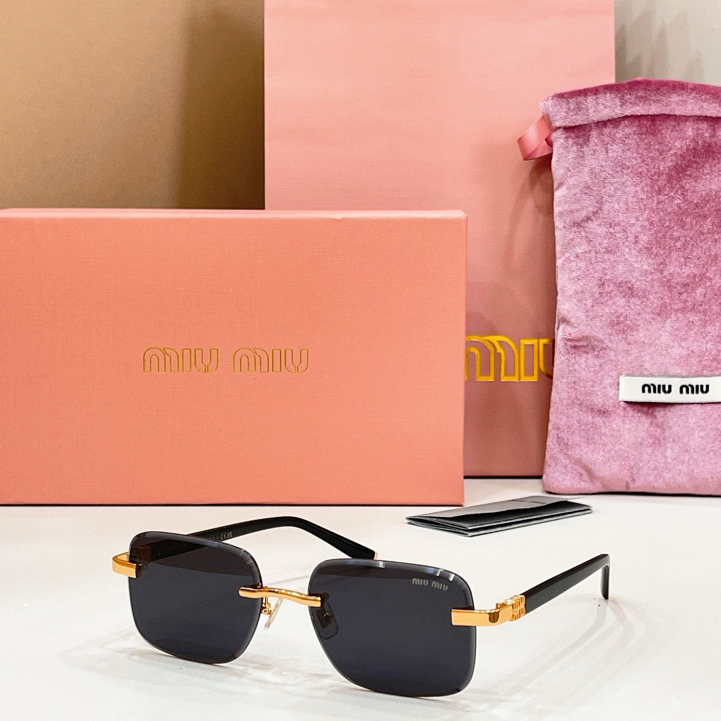Sunglasses with black lenses and gold metal frame and temples
