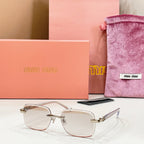 Sunglasses with clear frame and lightly tinted lenses with gold metal temples