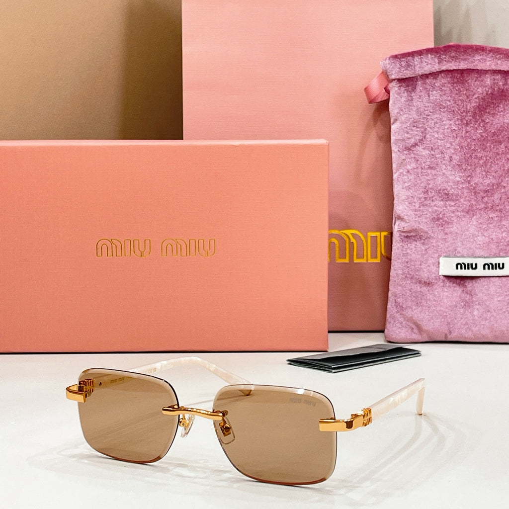 Sunglasses with tan-tinted lenses and gold metal frame and temples