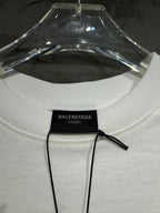 White Balenciaga T-shirt showing crew neck and black Unisex size tag