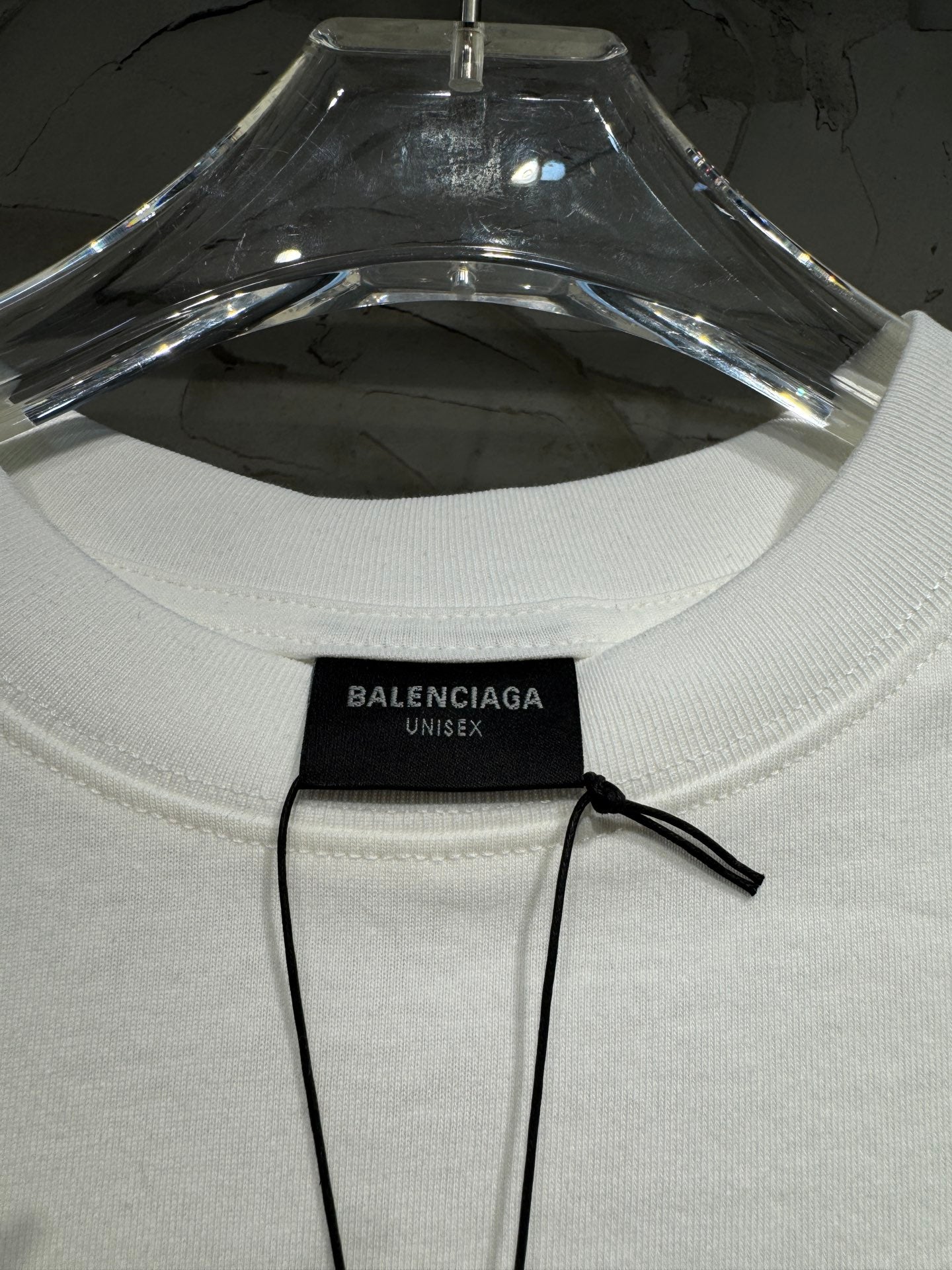 White Balenciaga T-shirt showing crew neck and black Unisex size tag