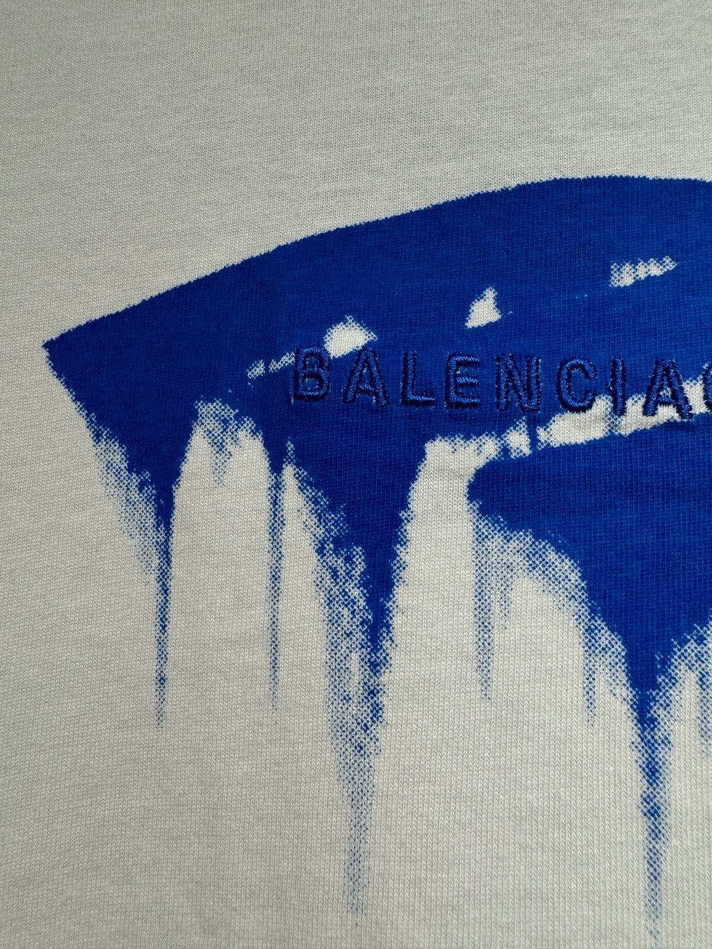 White Balenciaga T-shirt with blue drip logo and distressed BALENCIAGA lettering