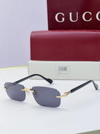 Gucci sunglasses with blue mirrored lenses, black frame, gold-tone bridge