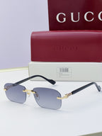 Gucci sunglasses with blue mirrored lenses, black temples, gold-tone metal bridge