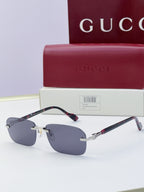 Gucci sunglasses with blue mirrored lenses and tortoiseshell temple accents, gold-tone hardware