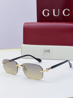 Gucci sunglasses with clear smoke lenses, black temples, gold-tone metal bridge