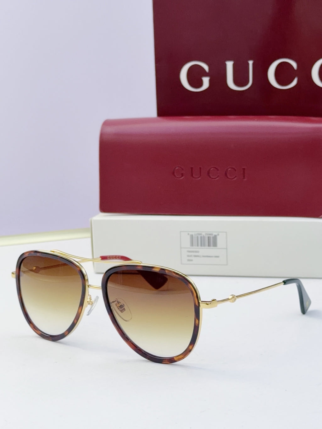 Gucci glasses with amber lenses and gold metal frames, round cat-eye style