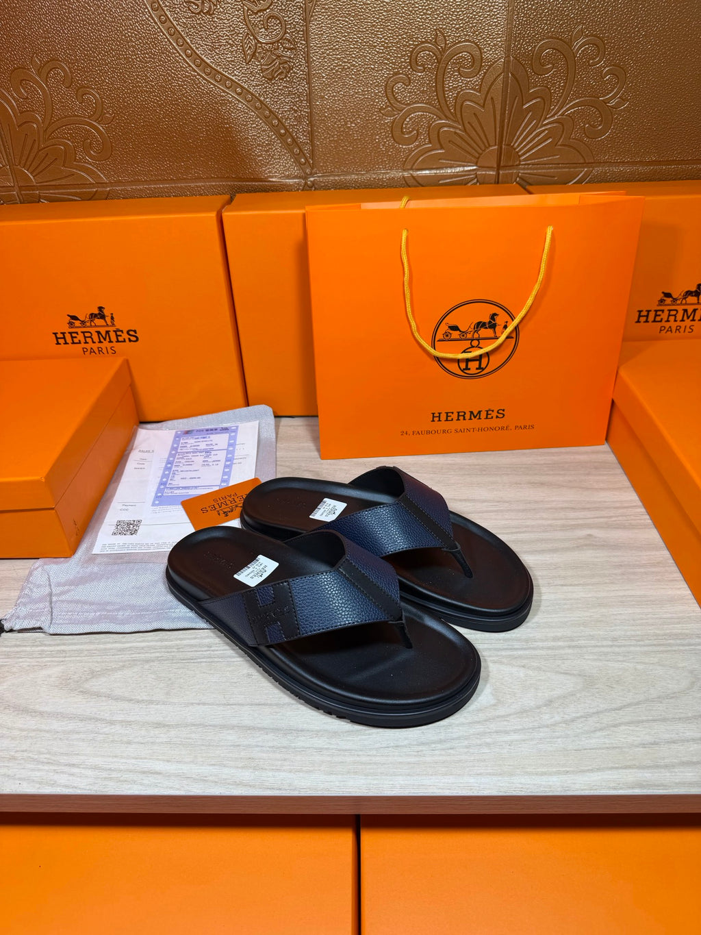 Black slide sandals with crossover straps and flat sole, side view