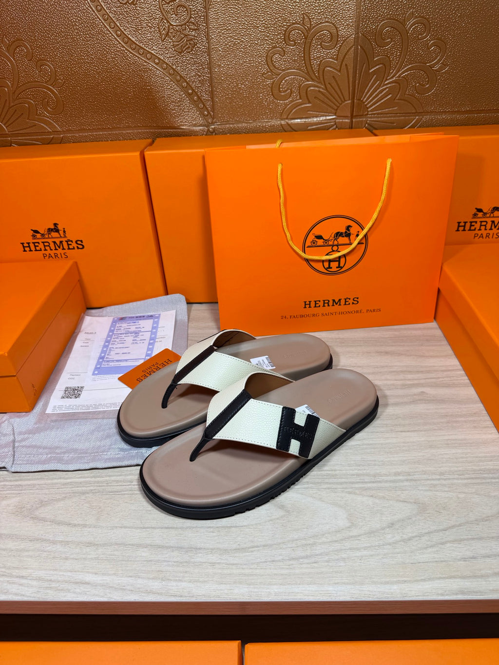 Luxury Hermes thong sandals, cream footbed with white strap and black H buckle
