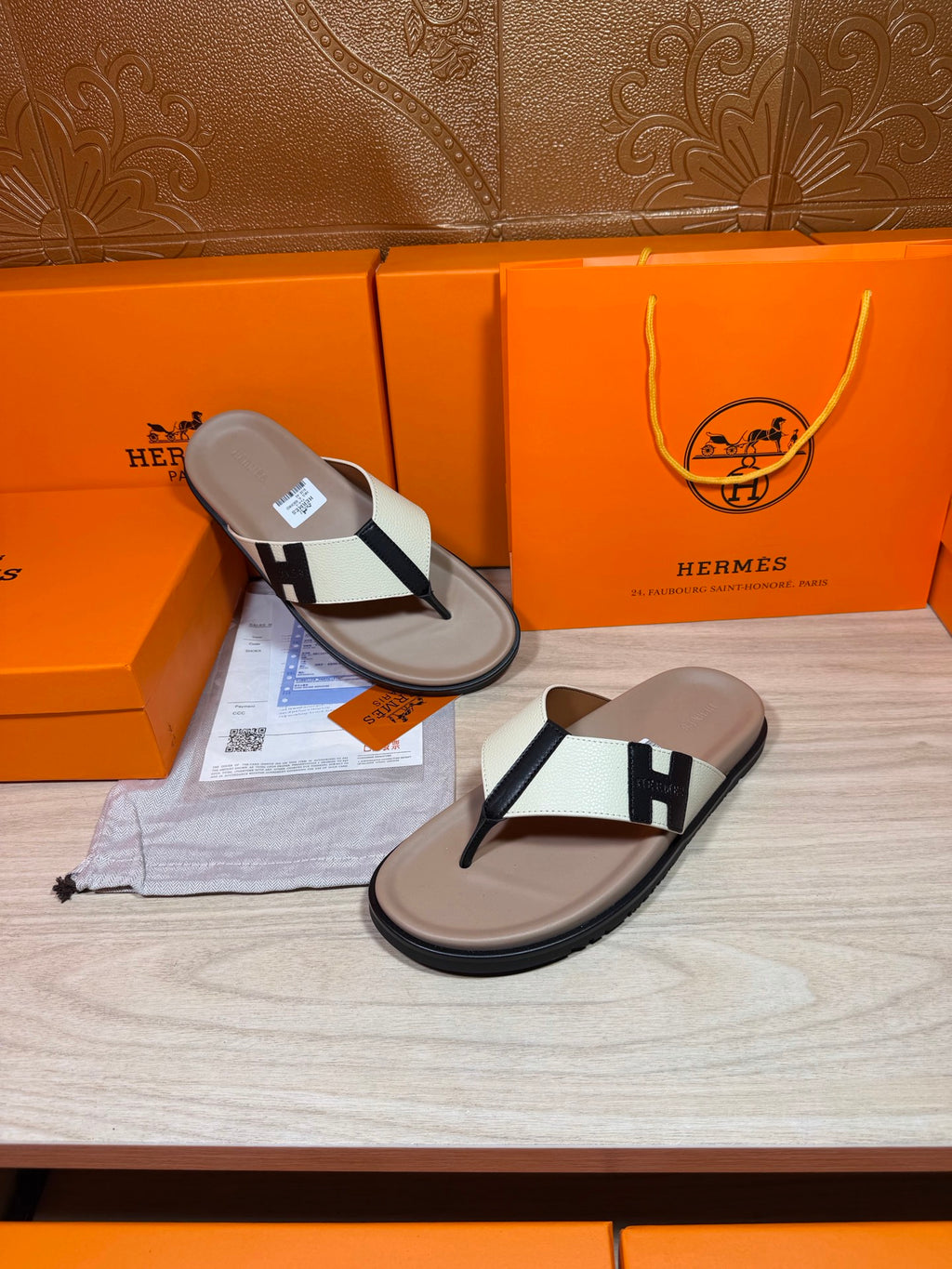 Luxury Hermes thong sandals, cream footbeds with white strap and black H buckle