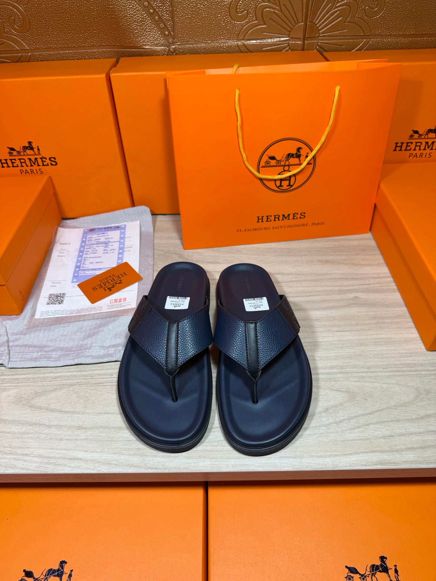 Hermes dark blue leather flip-flop sandals with textured strap and thong sole