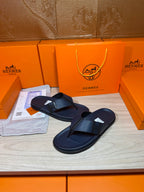 Hermes dark blue leather flip-flop sandals with cross strap detail