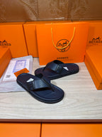 Hermes dark blue leather flip-flop sandals with wide strap and low-profile sole