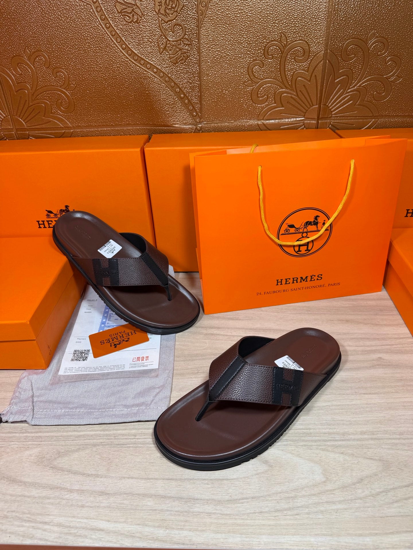 Dark leather thong sandals with black straps, side by side