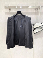 Leather jacket by Prada with snap buttons and interior lining