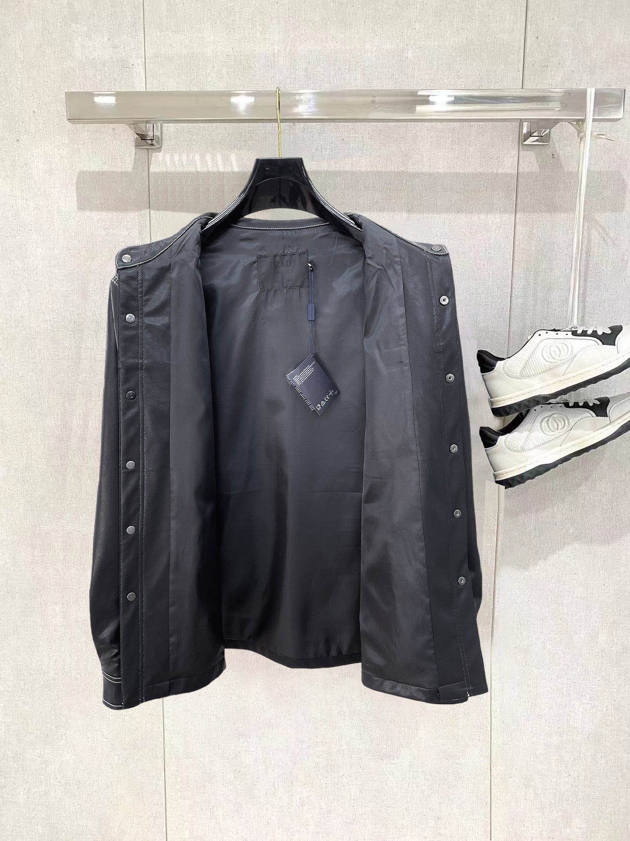 Leather jacket by Prada with snap buttons and interior lining