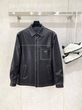 Leather jacket by Prada with stand collar, snap front, and chest pockets