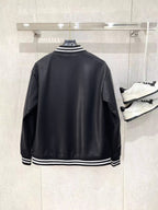 Black leather bomber jacket back view with striped ribbed collar and hem