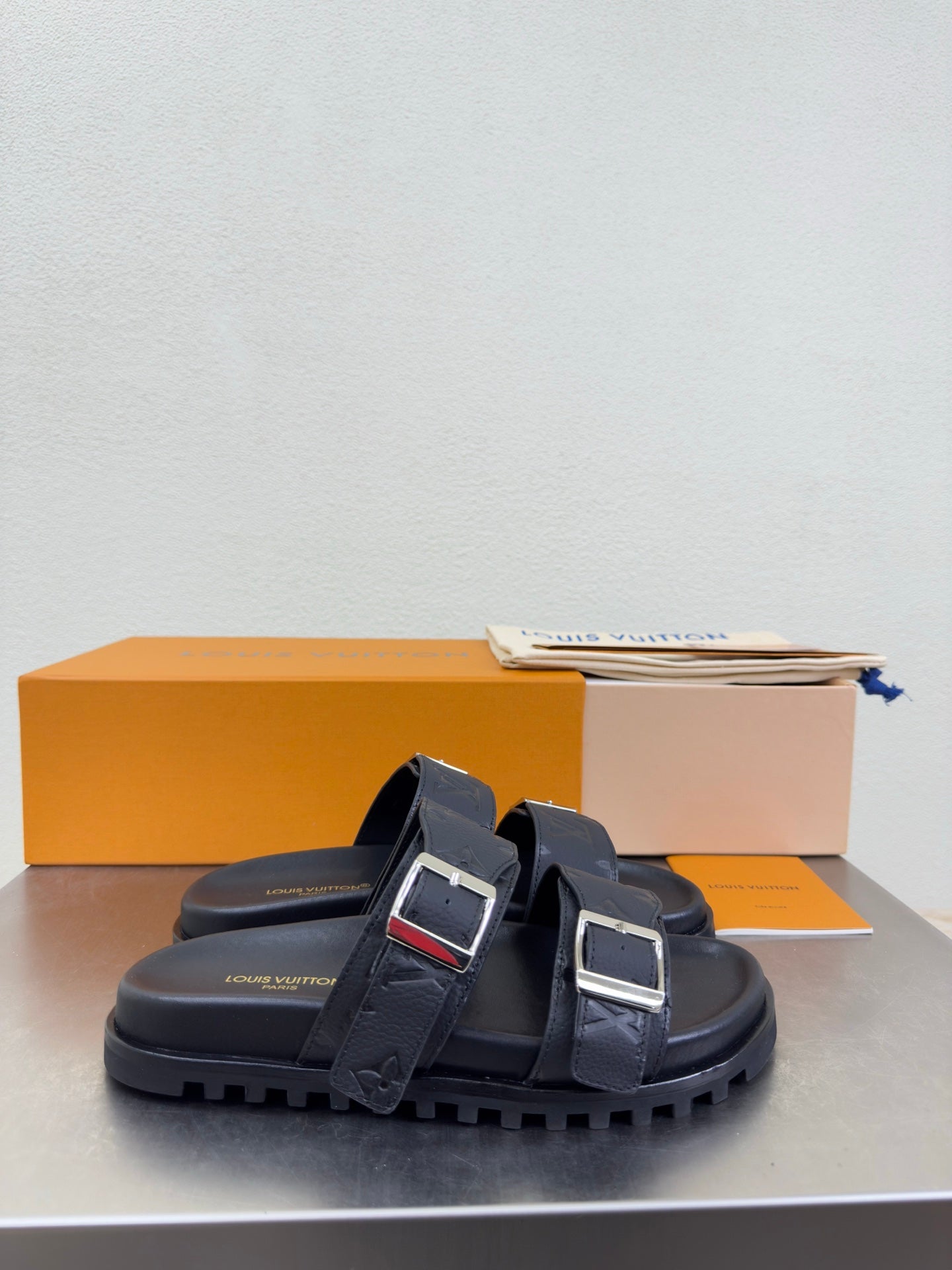 Louis Vuitton sandals with thick dark rubber sole and double straps with silver buckles