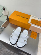 White Louis Vuitton sandals with two adjustable buckle straps and chunky sole