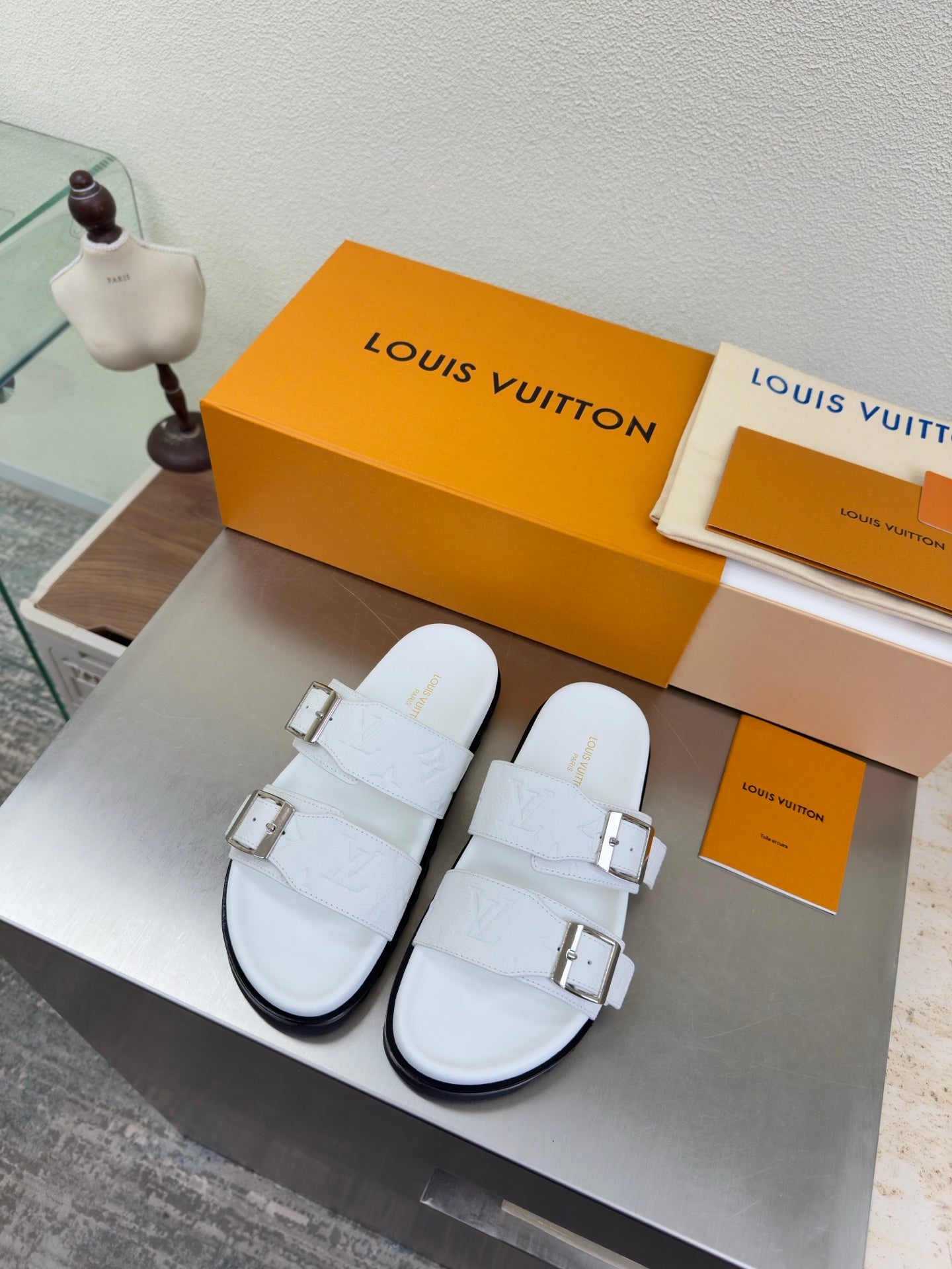 White Louis Vuitton sandals with two adjustable buckle straps and chunky sole