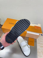 Bottom view of Louis Vuitton sandals with black rubber sole and tread pattern