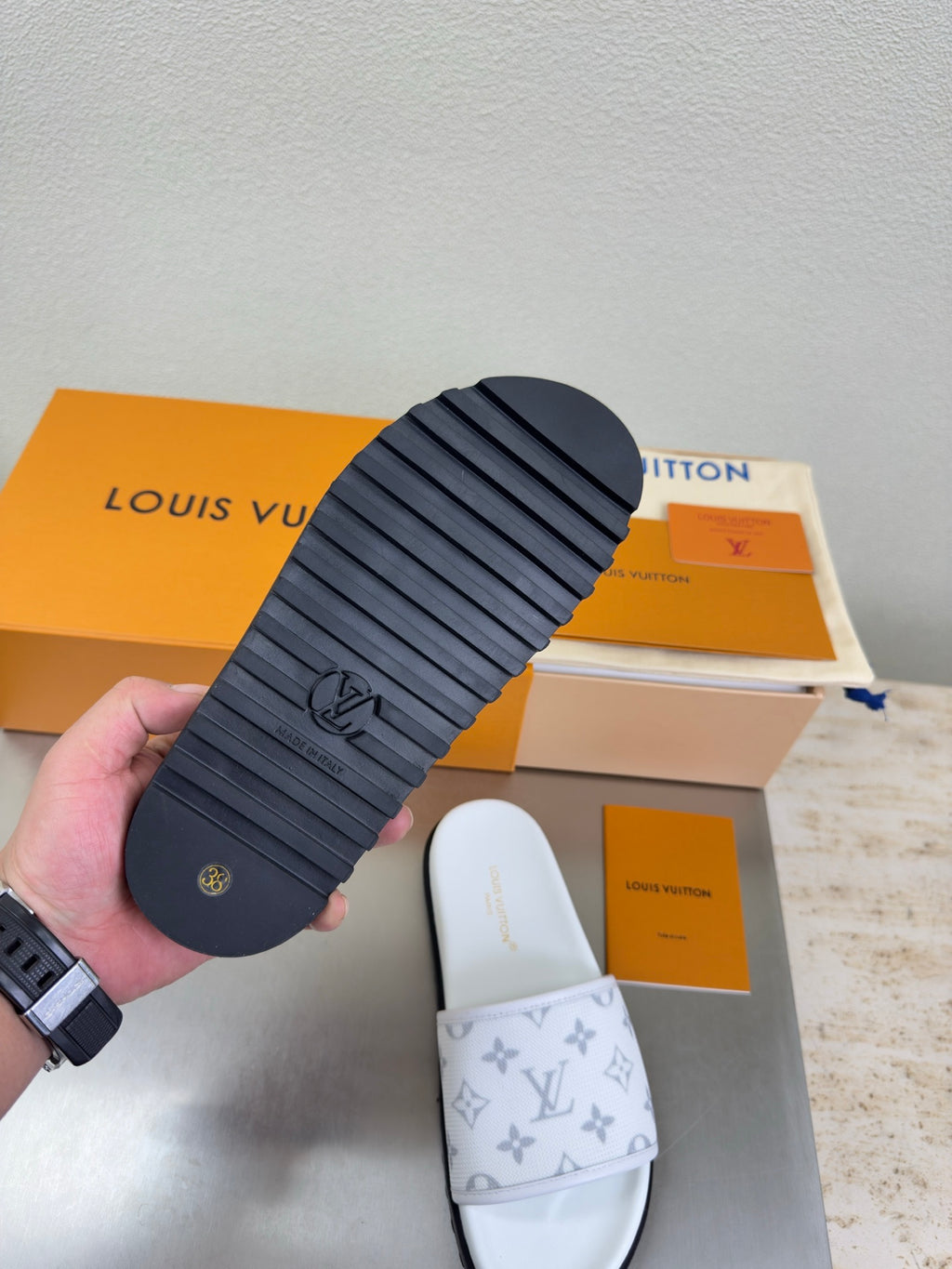 Black rubber sole and white monogram slide strap sandal