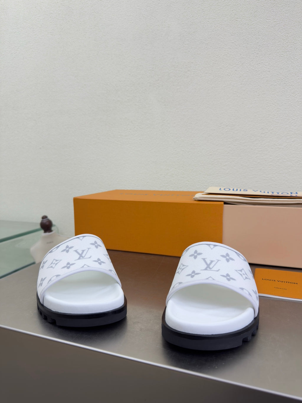White monogram slide sandals with thick sole