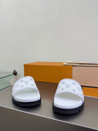 White monogram slide sandals with thick sole