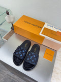 Louis Vuitton slide sandals with dark navy upper and blue monogram pattern