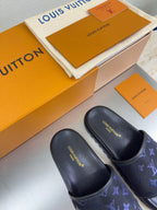 Pair of Louis Vuitton slide sandals, dark upper with blue monogram logo