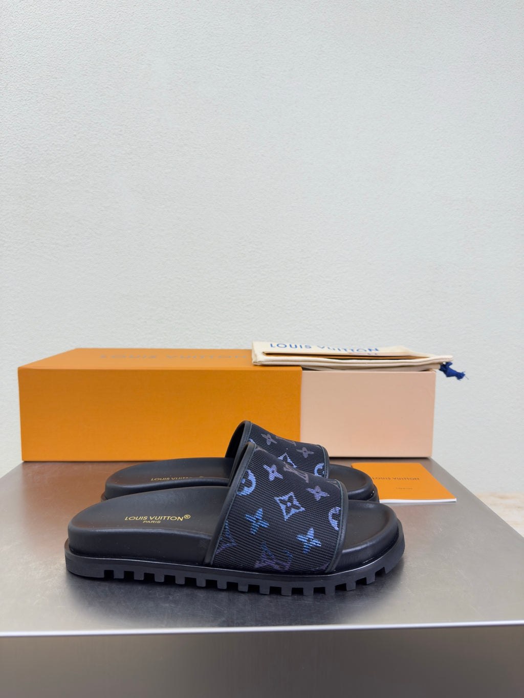 Louis Vuitton monogram slide sandals in dark navy with blue logo print