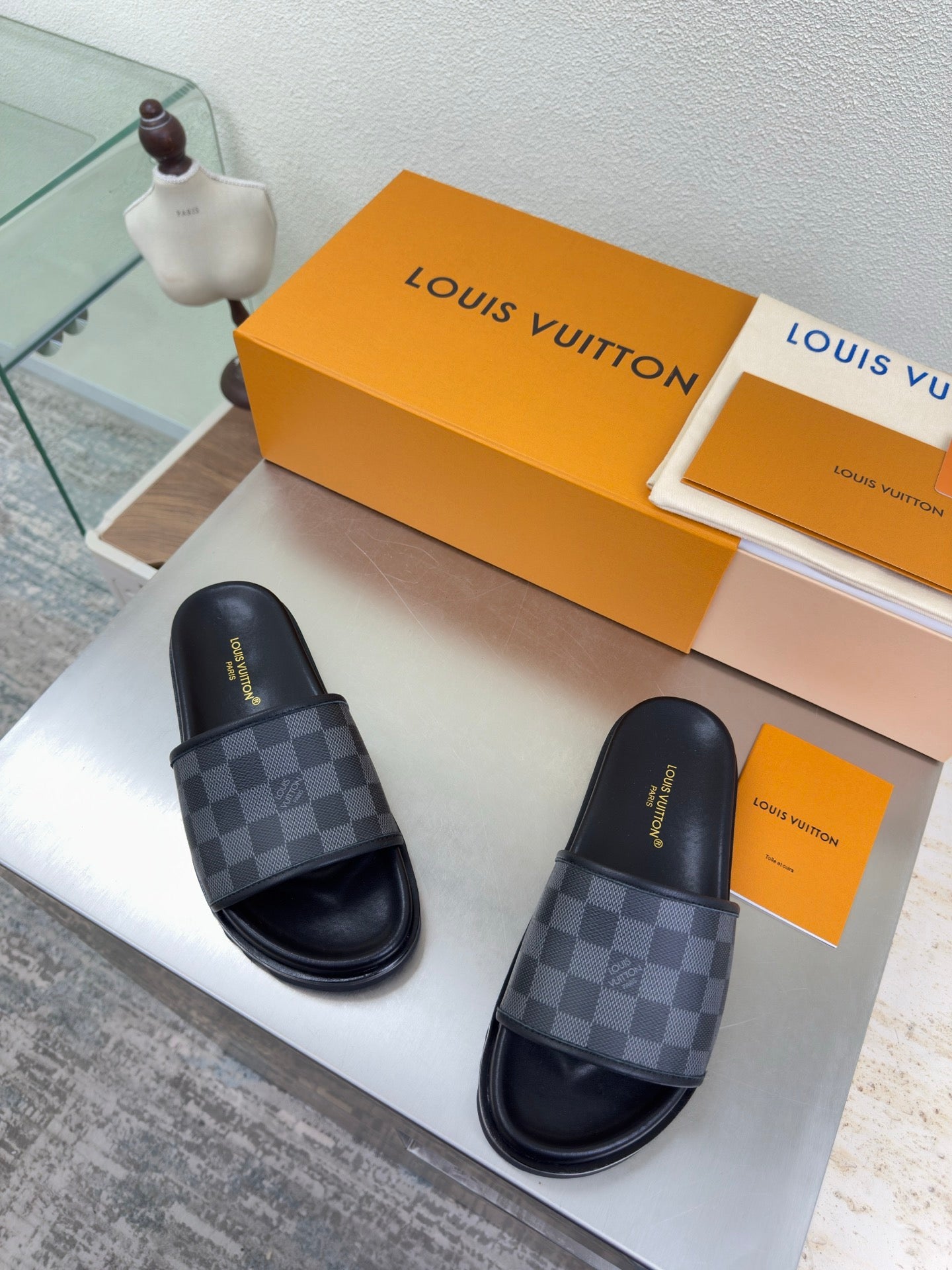Louis Vuitton slide sandals, dark check-pattern straps and black molded footbed