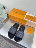Louis Vuitton slide sandals with dark check-pattern straps and cushioned footbed